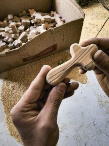 Bethlehem, Palestine, May 2022. Elias Jalal Yusef Jaraysa creates the traditional and typical Palestinian wood carvings. Through his work he supports his family. While working with producers specializing in olive wood, embroidery, mother of pearl, olive oil soap, felt wool, and recycled products, BFTA promotes and celebrates the Palestinian culture and traditions. Photo by Malak Hassan / WideOyster.com